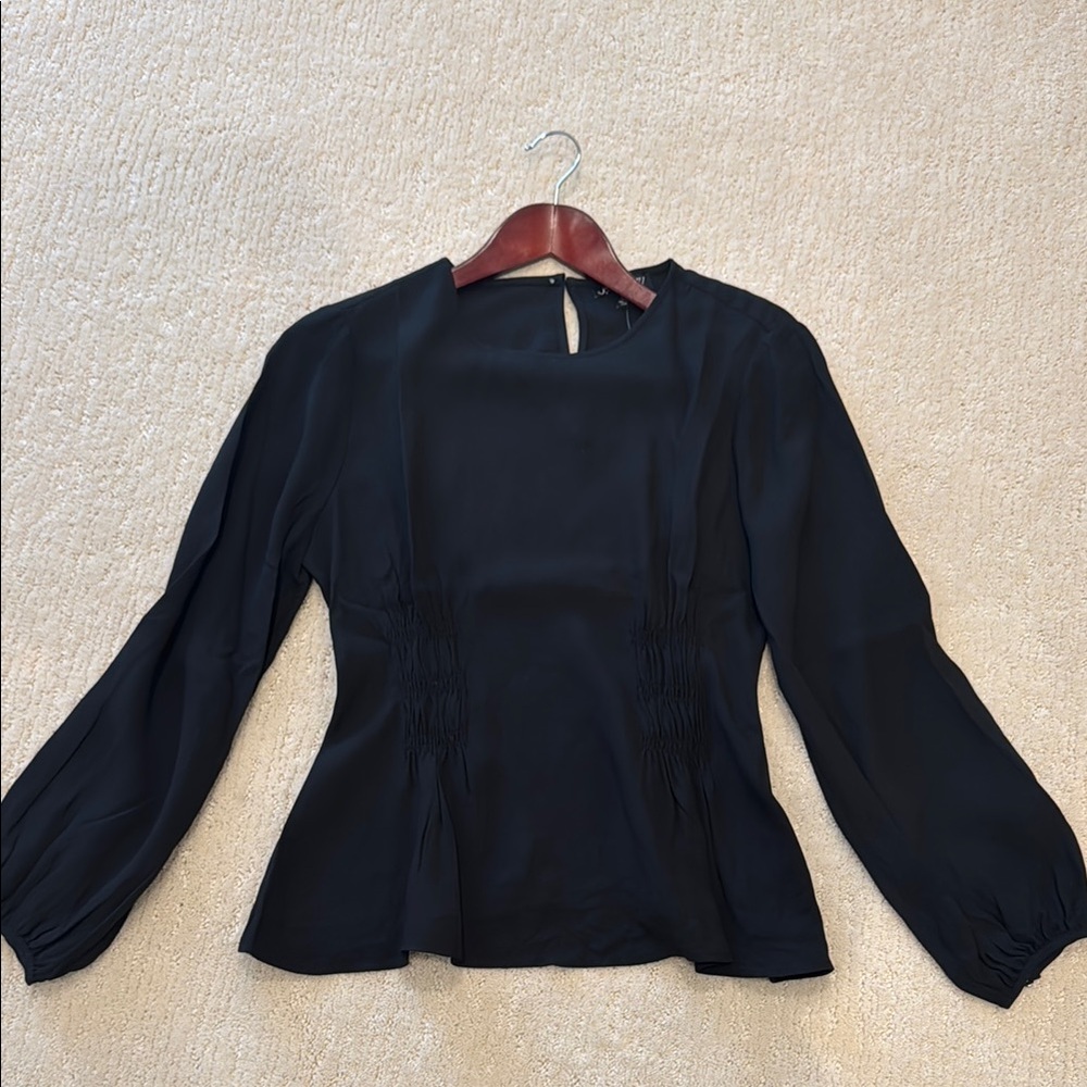 JCrew long sleeve blouse with ruching in front and back waist area. Black.
